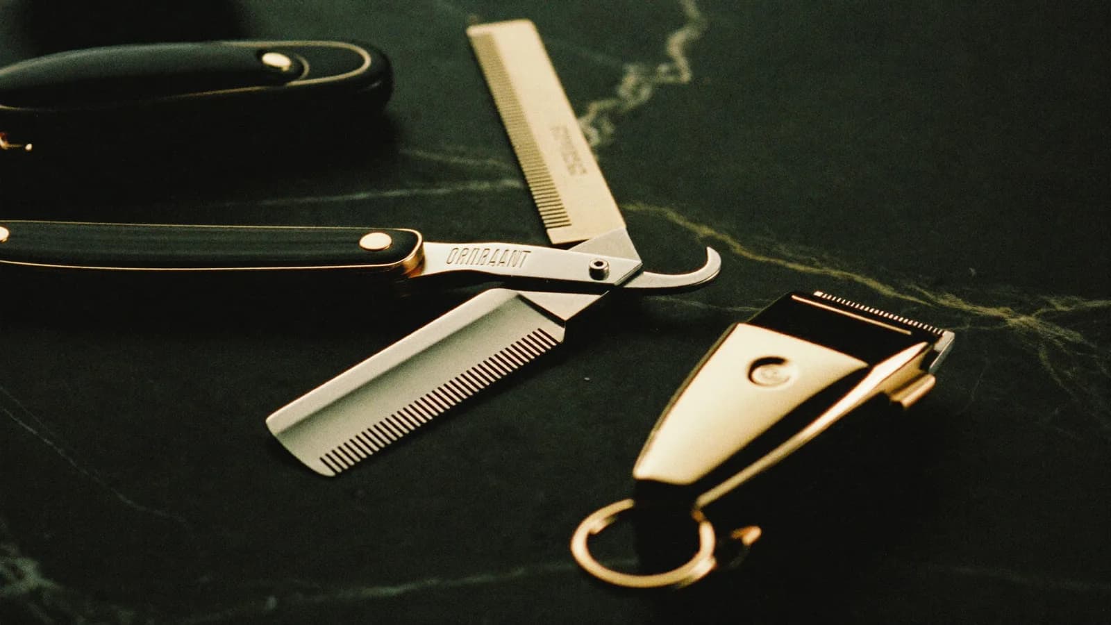 Barber's tools and hands at work behind the chair