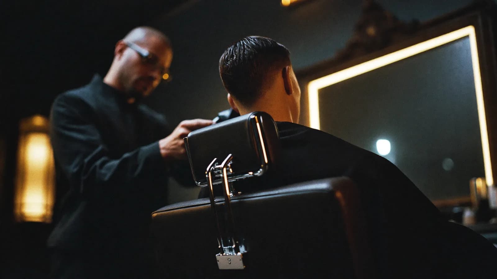 Barber giving a sharp skin fade in a modern barbershop